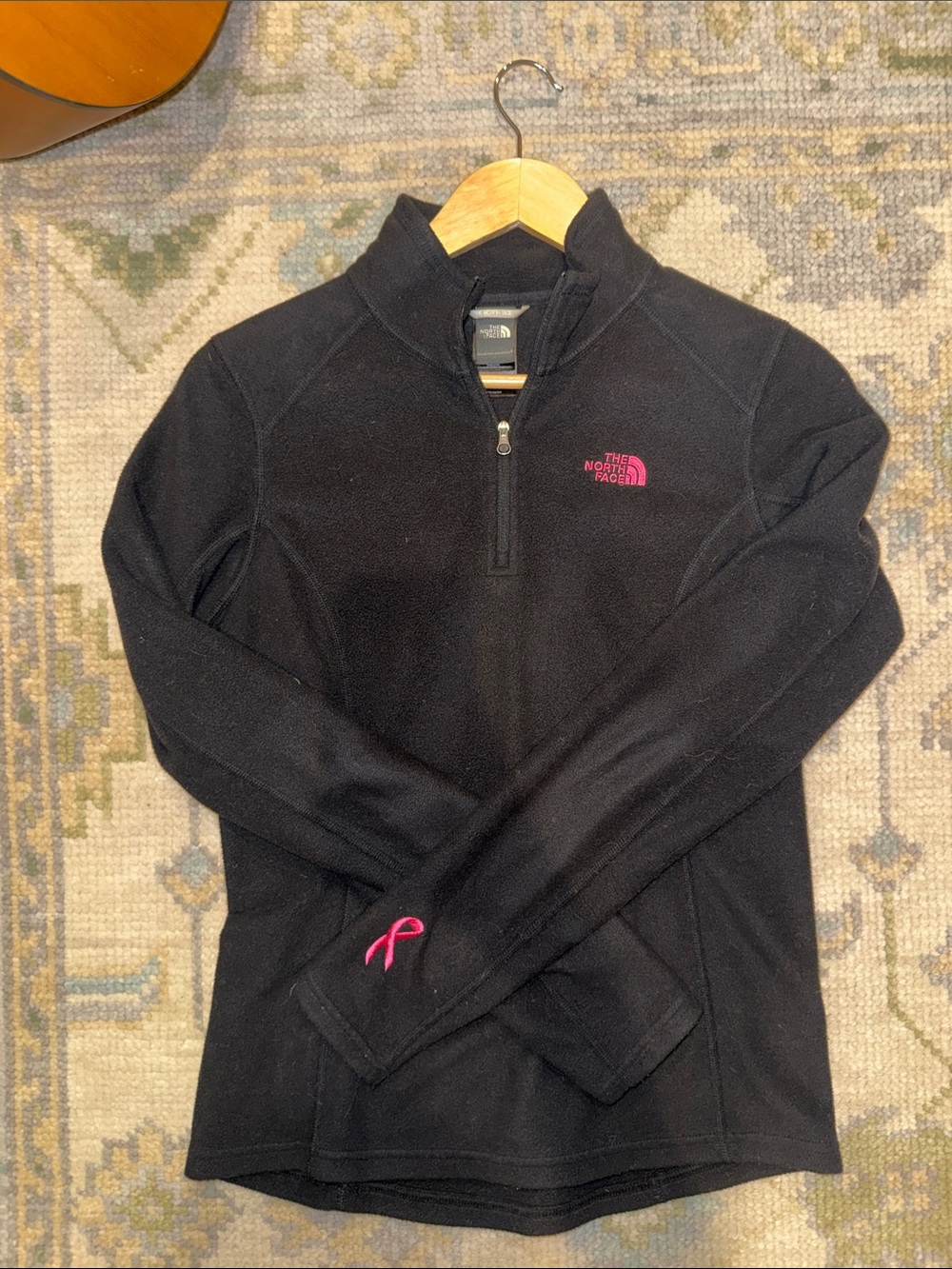 The North Face Women’s Black Quarter-Zip base layer Fleece with Pink Ribbon